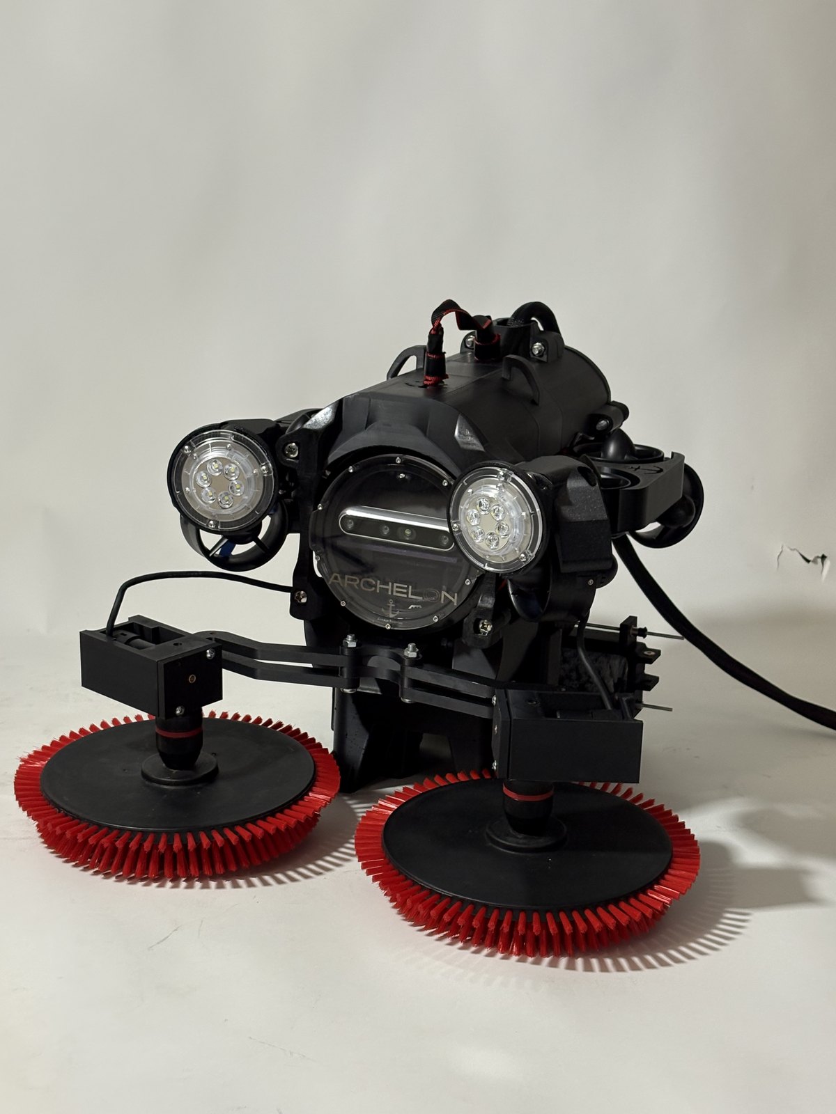 Front view of the vehicle with hull-cleaning brushes and lights